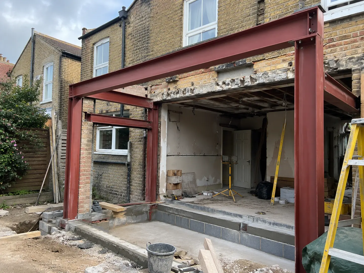 Structural steelwork installation during a South London kitchen extension build